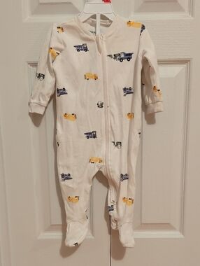 2/15$ Pekkle Cream Baby One-Piece with Yellow & Blue Truck Print